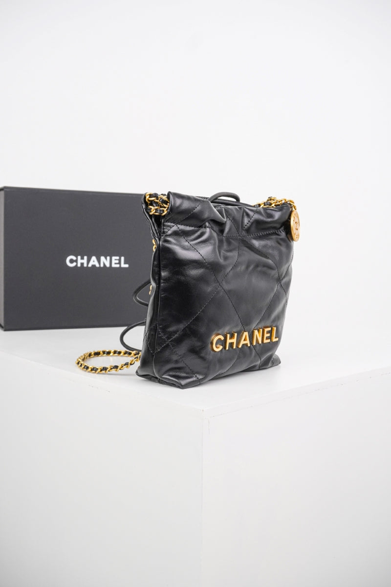 Bolsa Chanel 22 Hand Bag Gold Medium