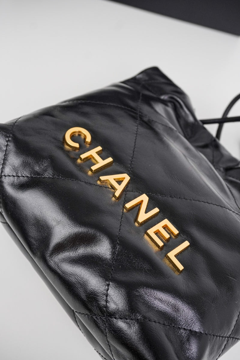 Bolsa Chanel 22 Hand Bag Gold Medium